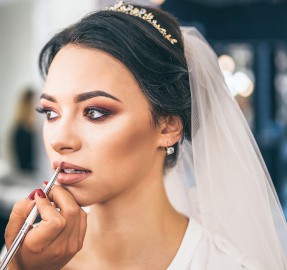Beautiful bride on makeup before wediing